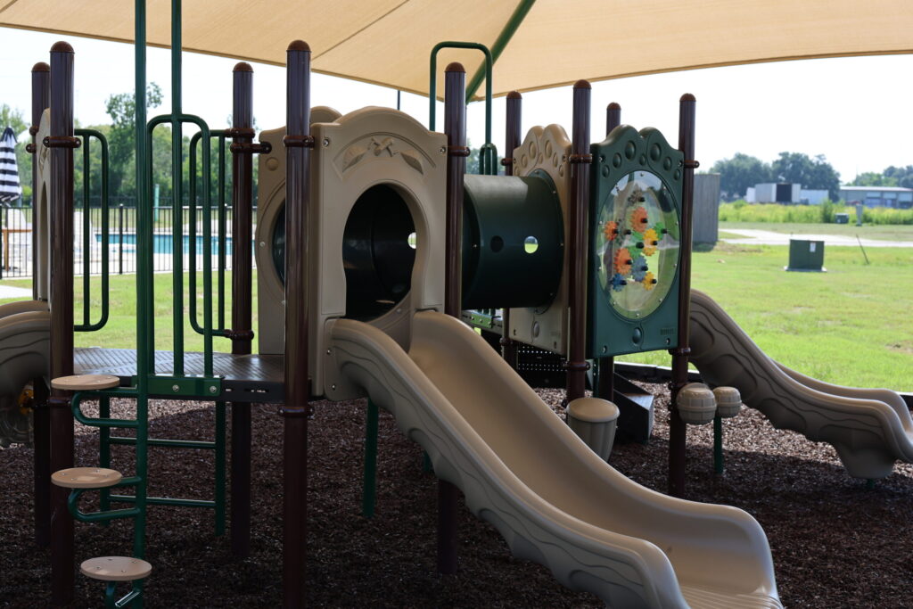 Colorful playground equipment under shade
